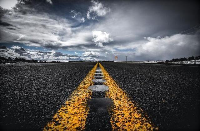A road with yellow lines.