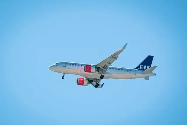 An airplane in the blue sky.